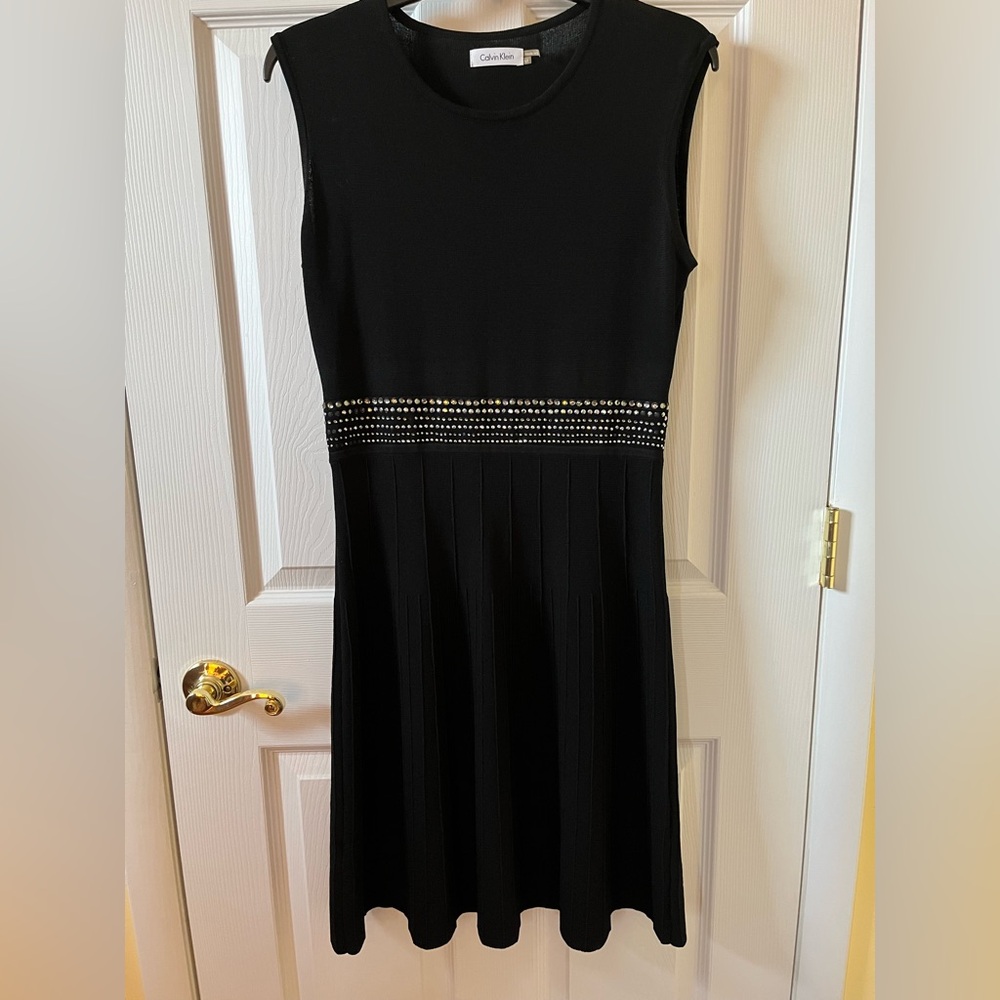 Elegant Black Sleeveless Dress with Embellished Waist